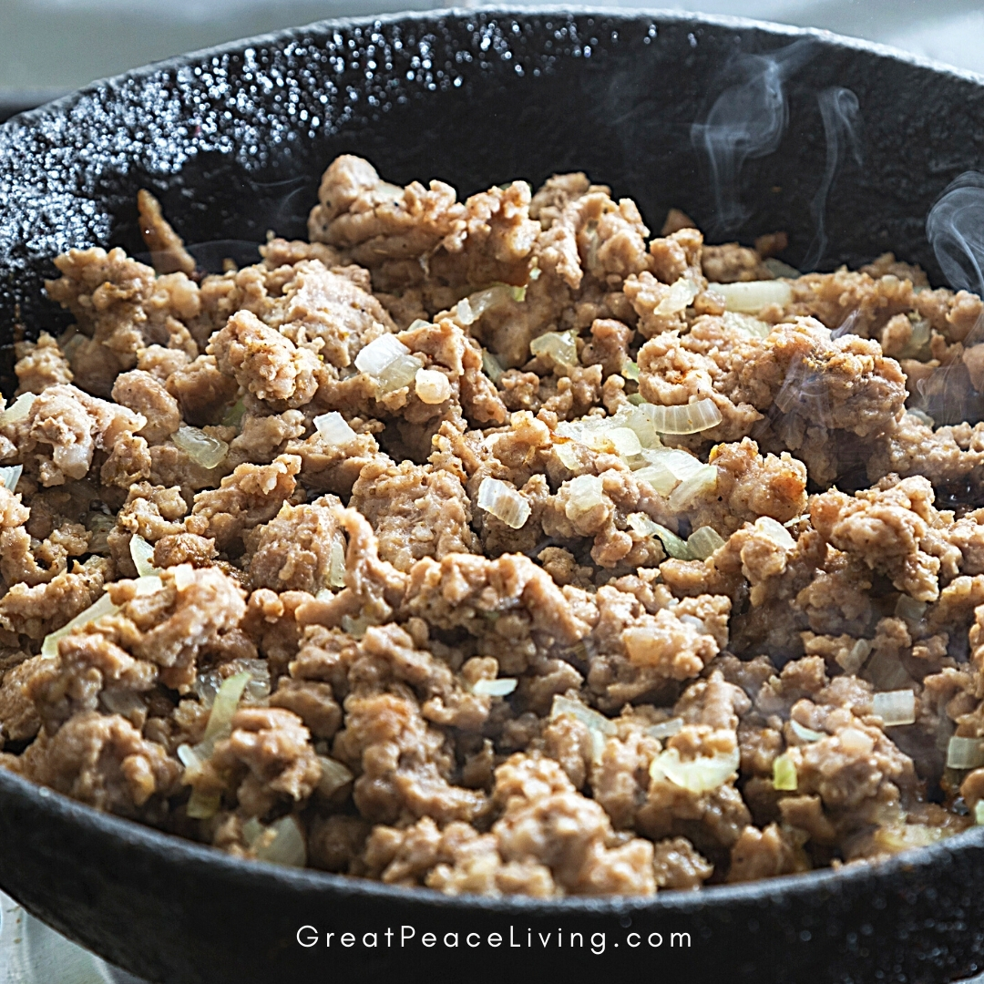 beef cooking in a skillet